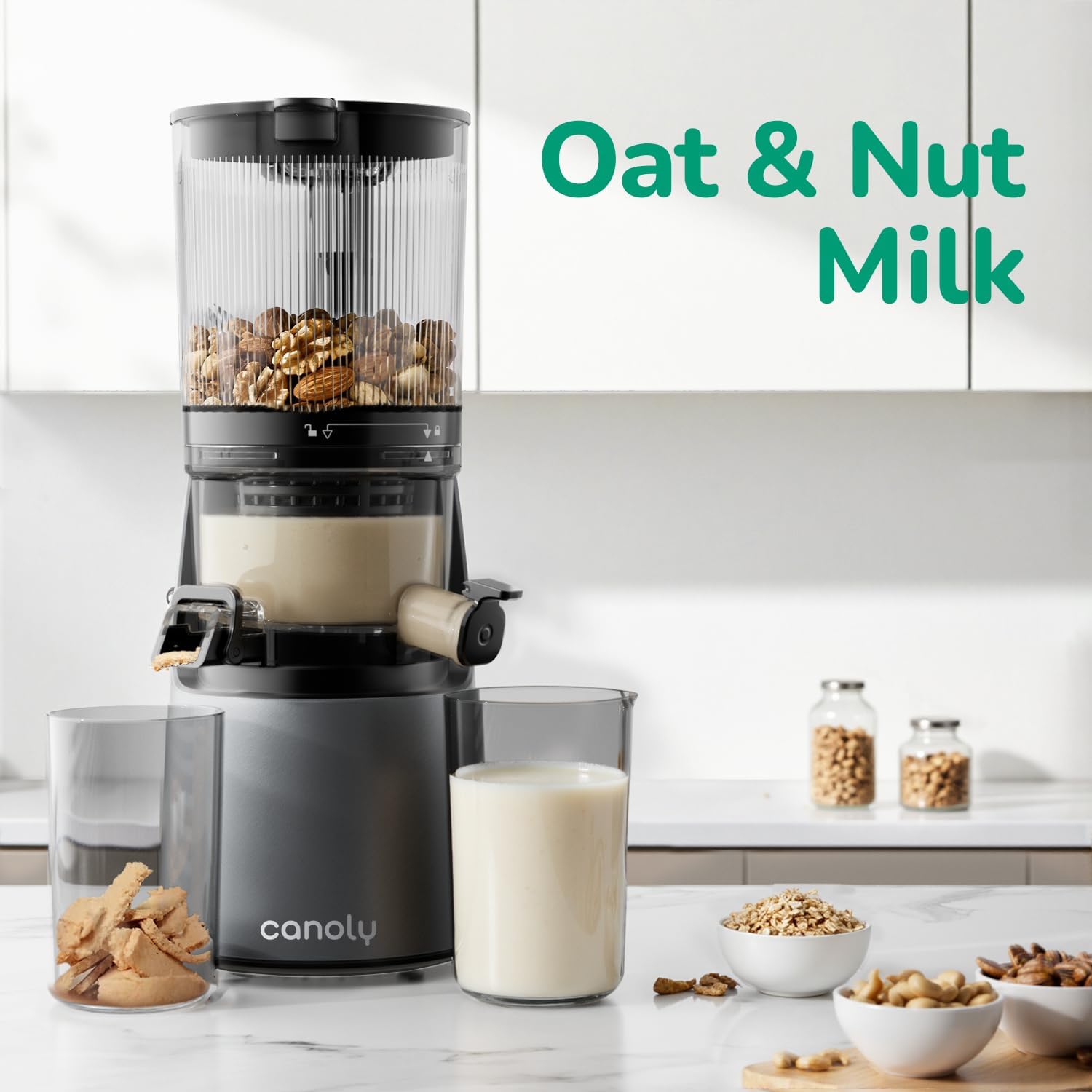 Canaly milk maker with ingredients and a glass of oat and nut milk on a kitchen counter.