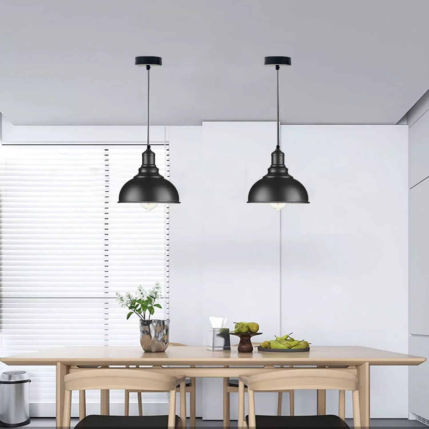 Rustic red metal shade pendant light illuminating a dining area

