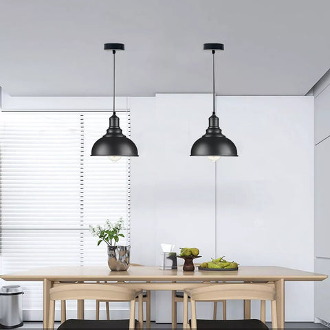 Rustic red metal shade pendant light illuminating a dining area

