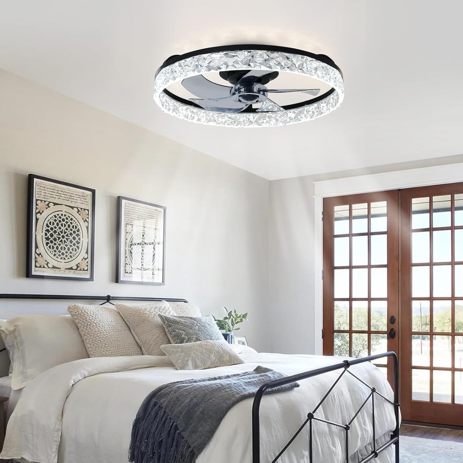 Ceiling fan with light fixture in a bedroom setting