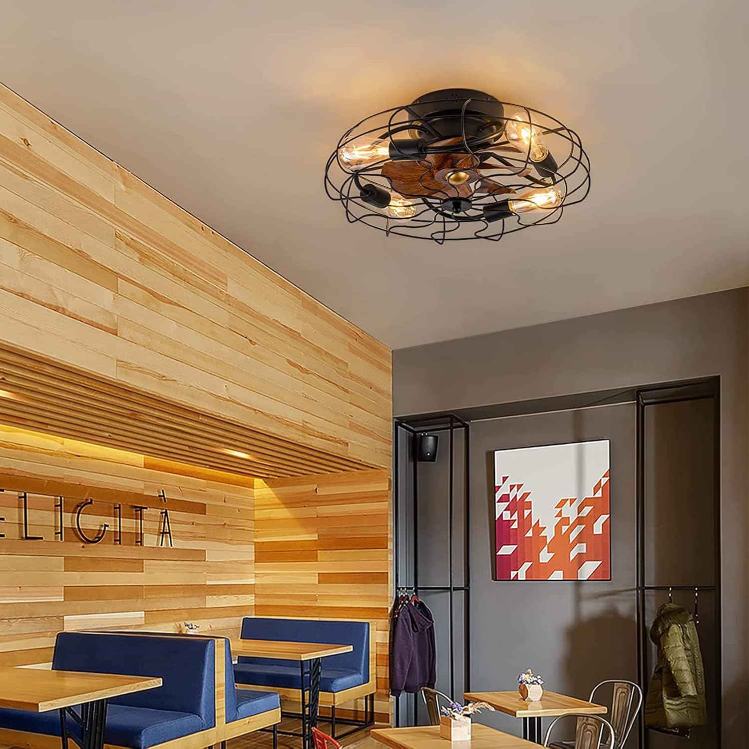 Ceiling light fixture in a modern interior setting with wooden walls and tables.