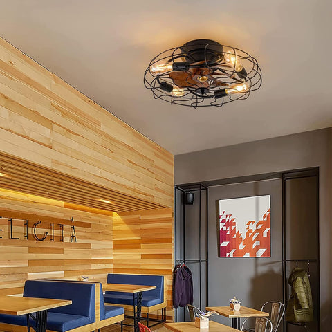 Ceiling light fixture in a modern interior setting with wooden walls and tables.