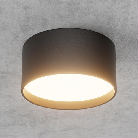 Ceiling light fixture on a gray concrete wall