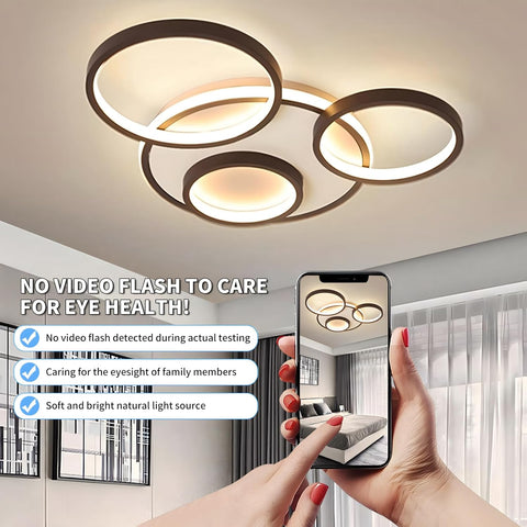 Ceiling light fixture with a smartphone showing a room view, emphasizing eye health benefits.