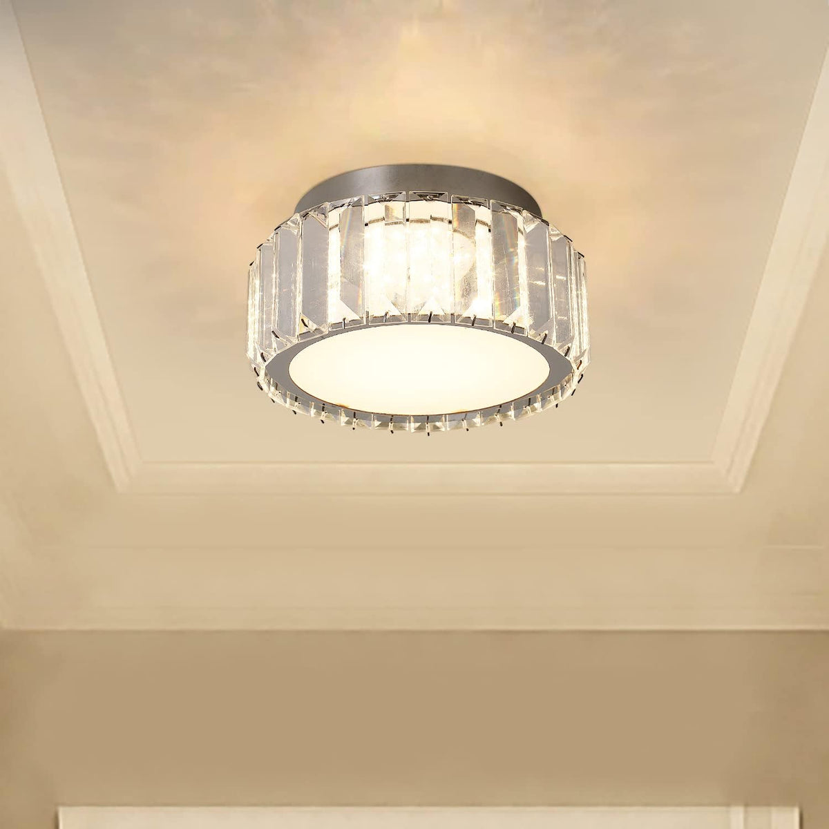 Ceiling light fixture with crystal accents on a beige ceiling