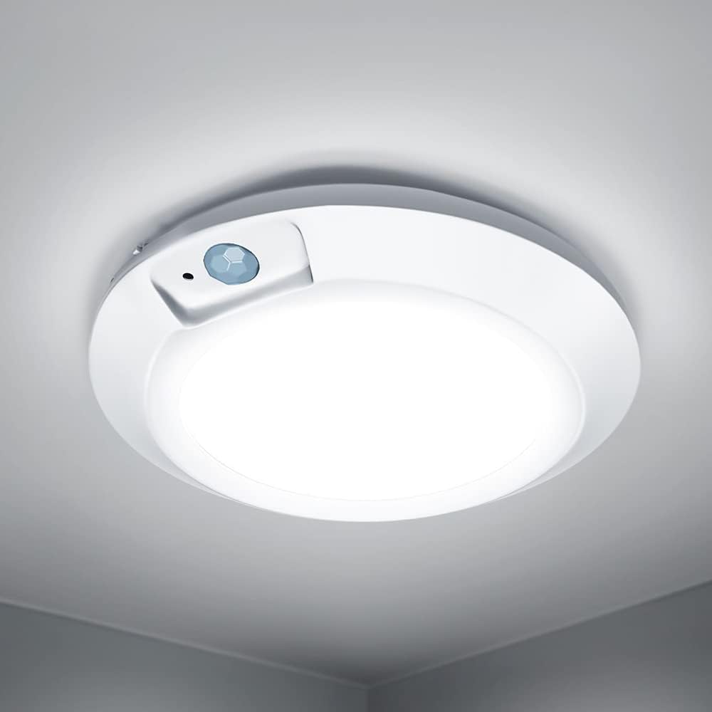 Ceiling light fixture with sensor on a white ceiling
