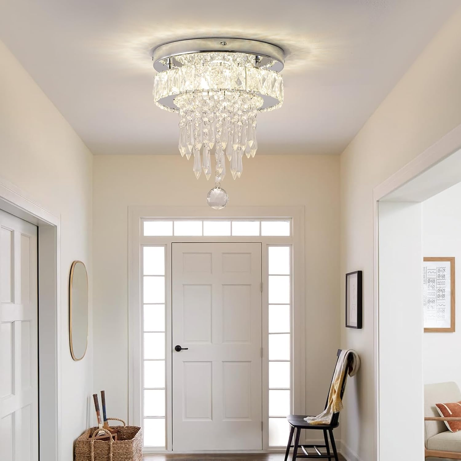 Chandelier hanging in a room with a door and wall decor