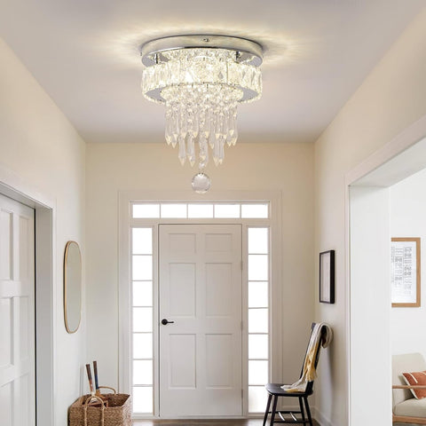 Chandelier hanging in a room with a door and wall decor