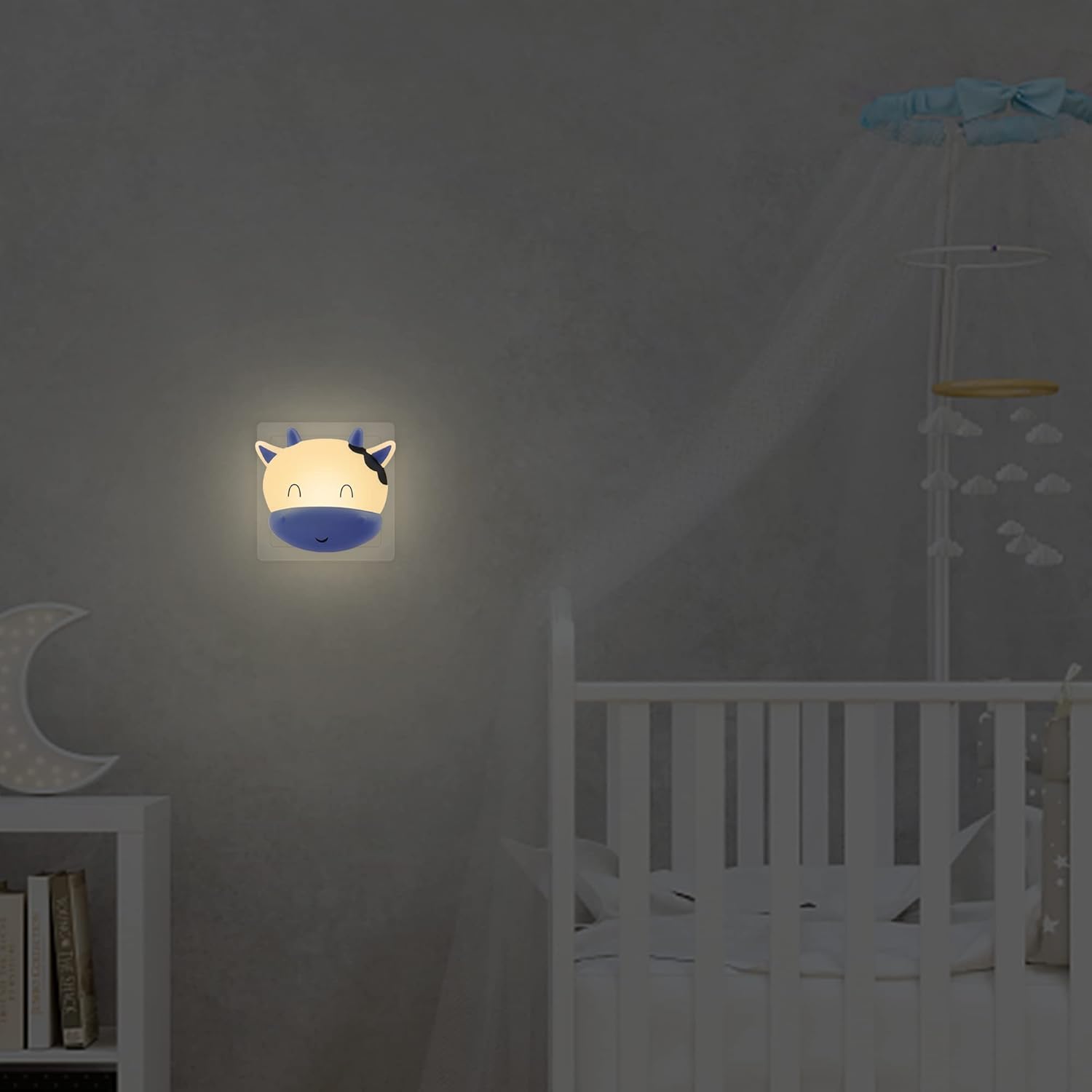 Children's night light shaped like a cartoon character on a wall in a bedroom.