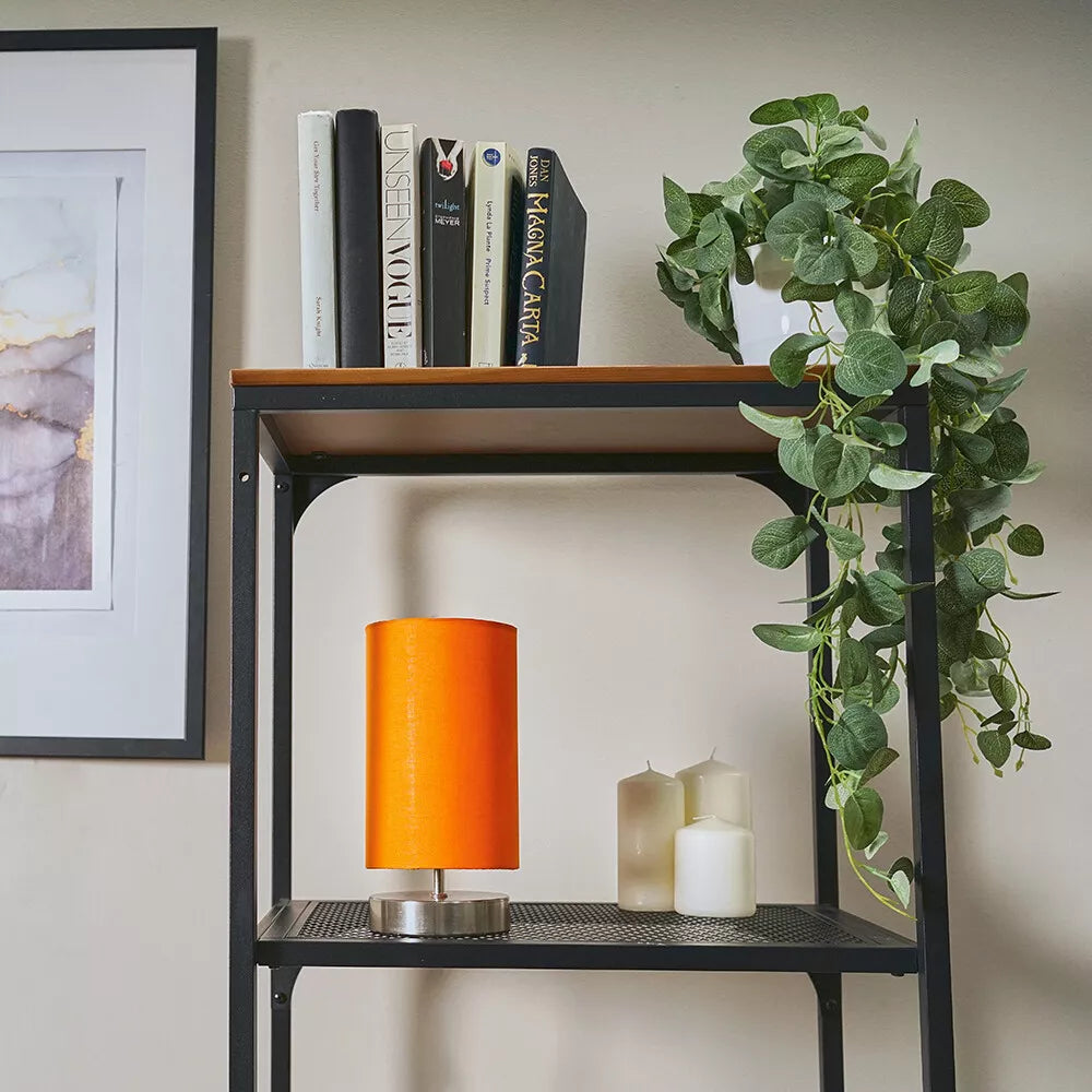 Close-up of the brushed chrome base of the bedside lamp – modern design UK.

