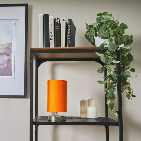 Close-up of the brushed chrome base of the bedside lamp – modern design UK.

