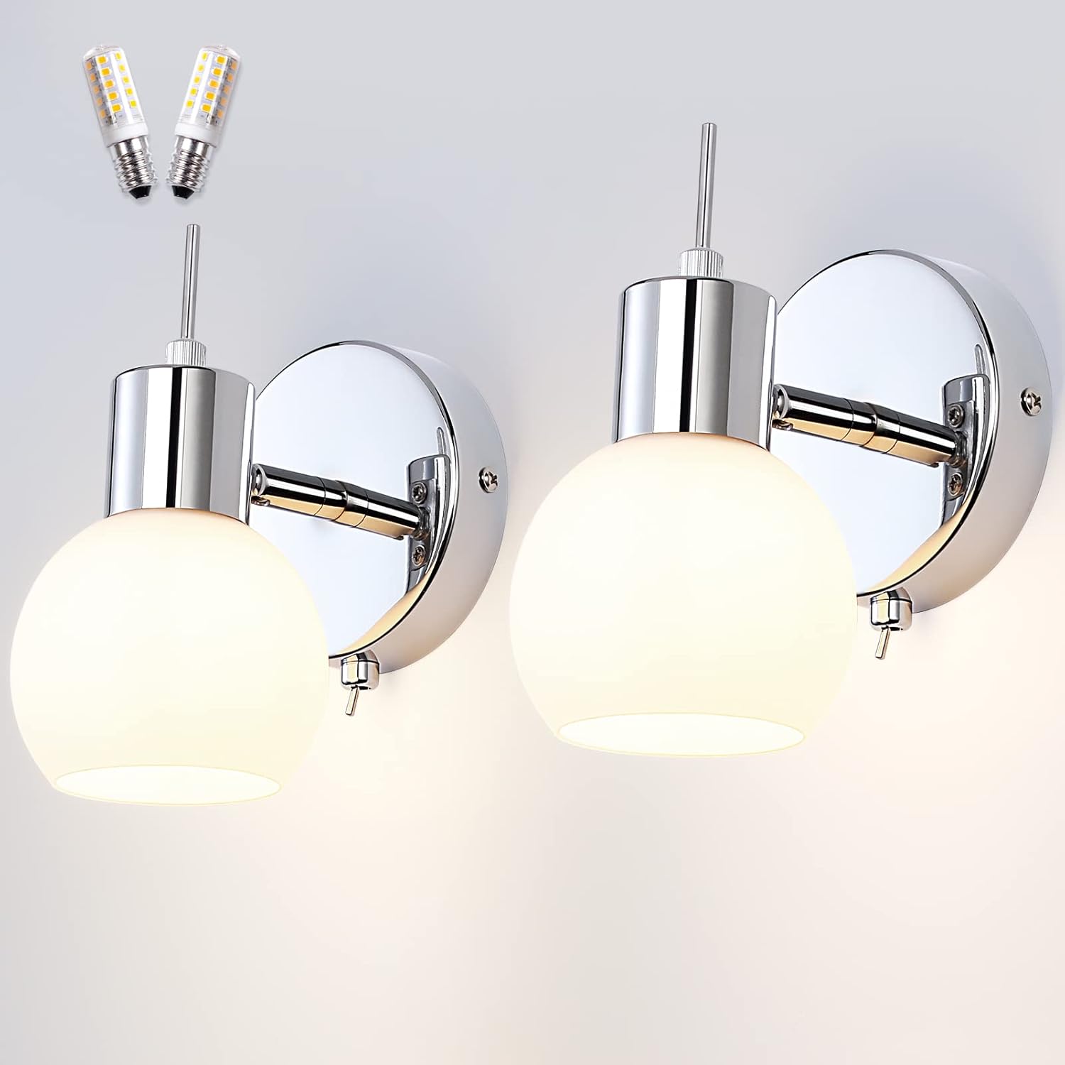 Chrome wall sconces with glass shades on a white background