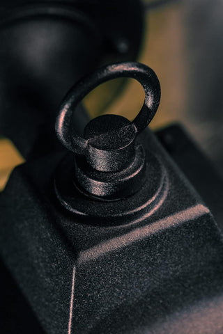 Close-up of a black mechanical component with a textured surface