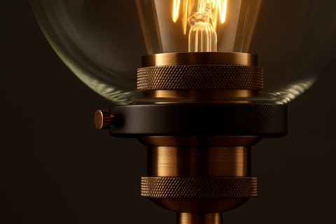 Close-up of a vintage-style light bulb with a dark background