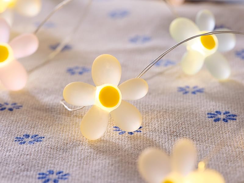 Close-up of pastel flower LED fairy lights with warm white illumination