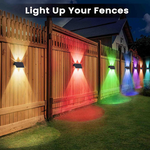 Colorful outdoor lights on a wooden fence with text 'Light Up Your Fences'.