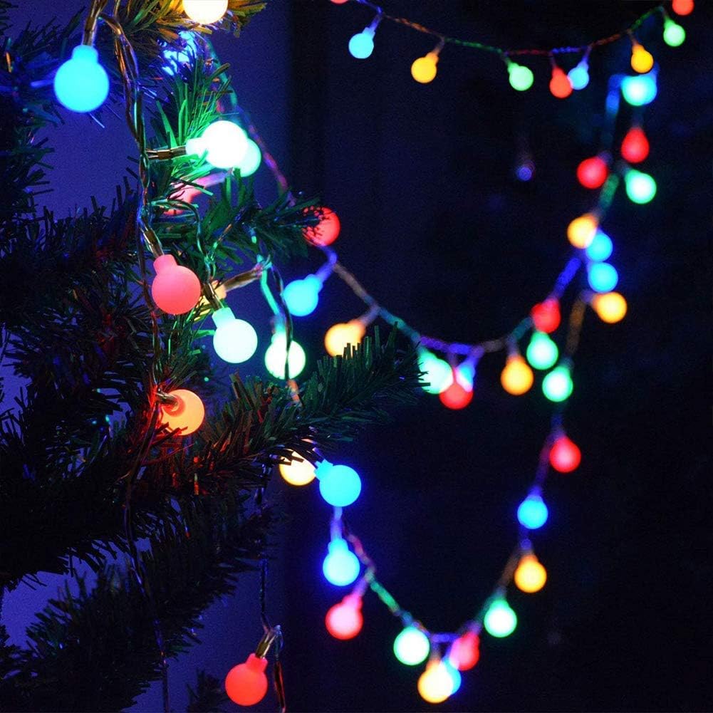 Colorful string lights draped over a Christmas tree against a dark background