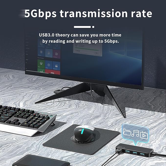 Computer setup with monitor, keyboard, mouse, and USB hub on a desk.