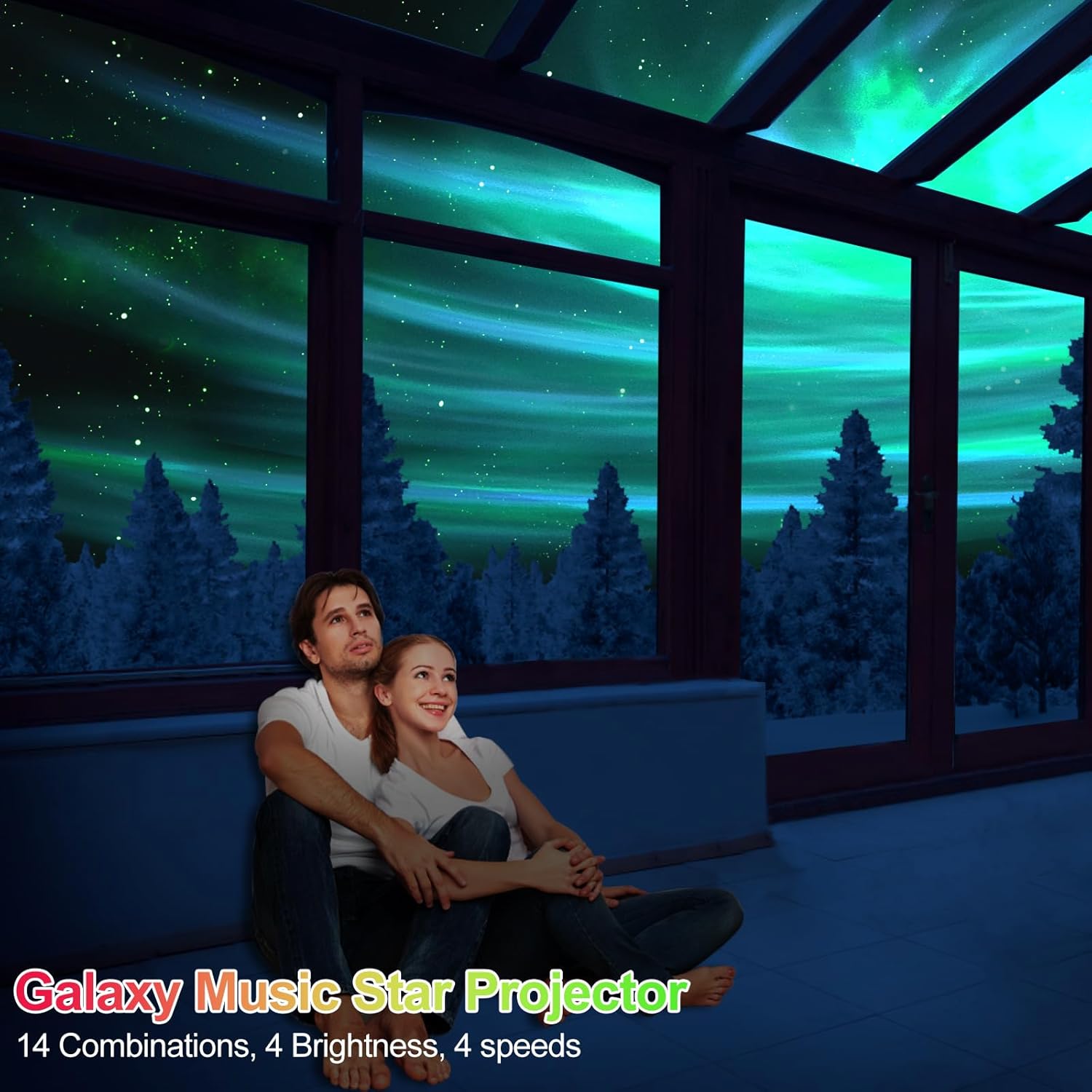 Couple sitting on a couch in a room with a galaxy-themed projector display.