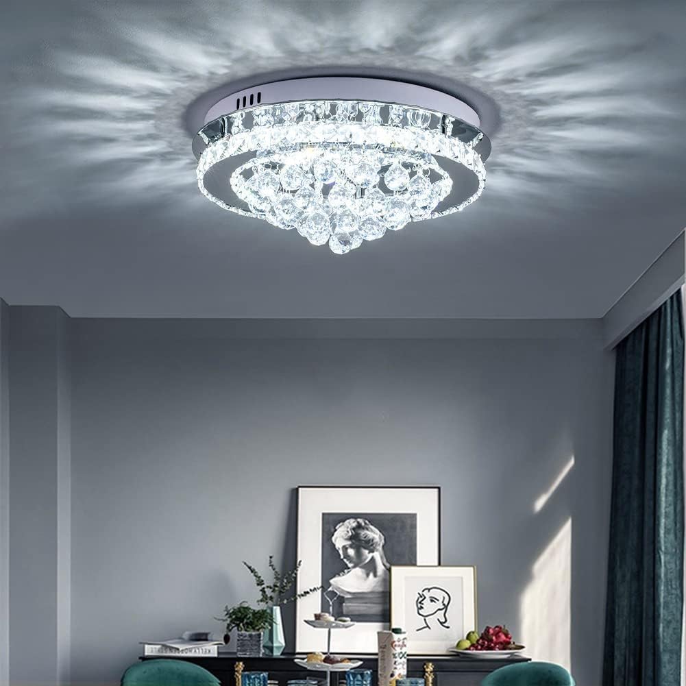 Crystal ceiling light fixture in a room with decor elements.