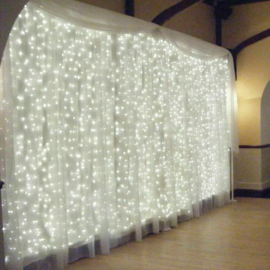 Waterfall curtain lights glowing in the dark


