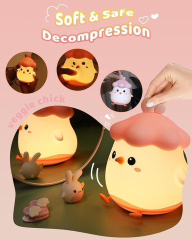 Cute chick-shaped night light with cartoon characters and text on a pink background