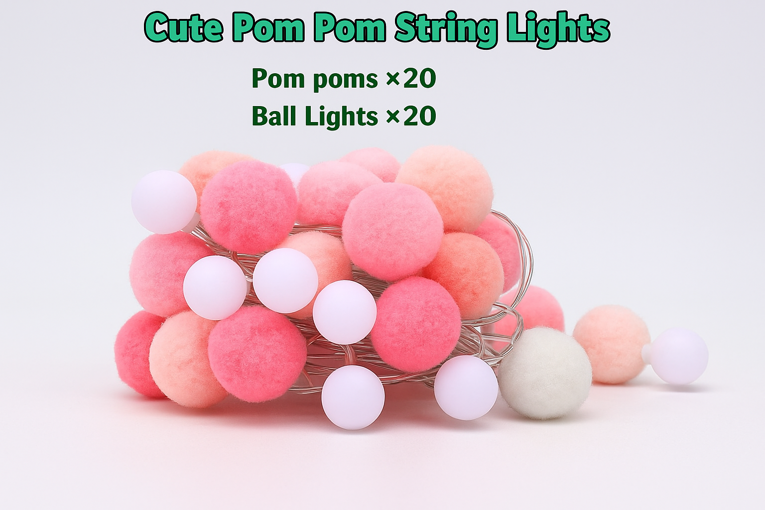 Cute pom pom string lights with pink, white, and beige pom poms on a white background.