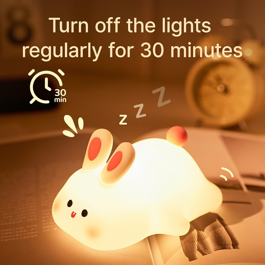 Cute rabbit-shaped night light with text on a blurred background