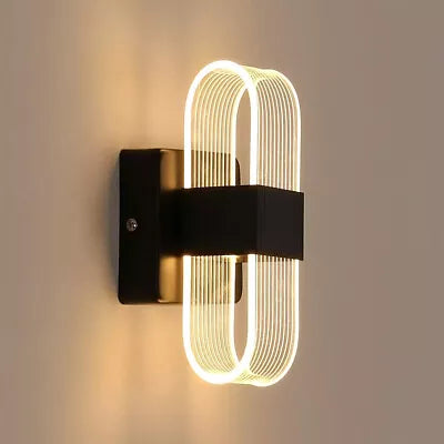 Wall-mounted D Wall Light with neutral white light in a hallway


