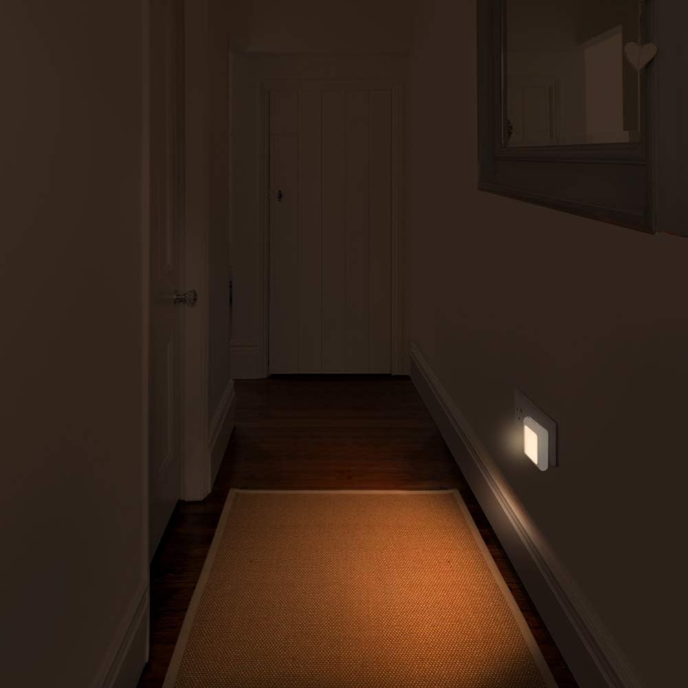 Dark hallway with a light switch on a wall