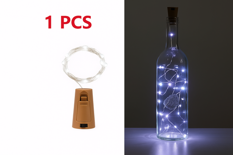 Decorative bottle with LED lights and cork, next to a string of lights on a white background.