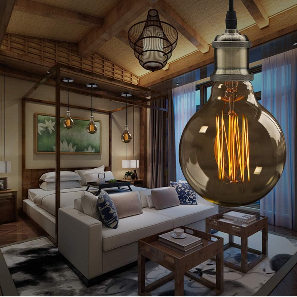 Decorative light bulb in a stylish living room with wooden ceiling and furniture.