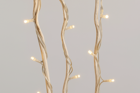 Decorative light fixture with branch-like design on a gray background