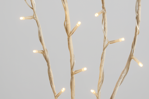 Decorative lighting fixture with branch-like design on a gray background
