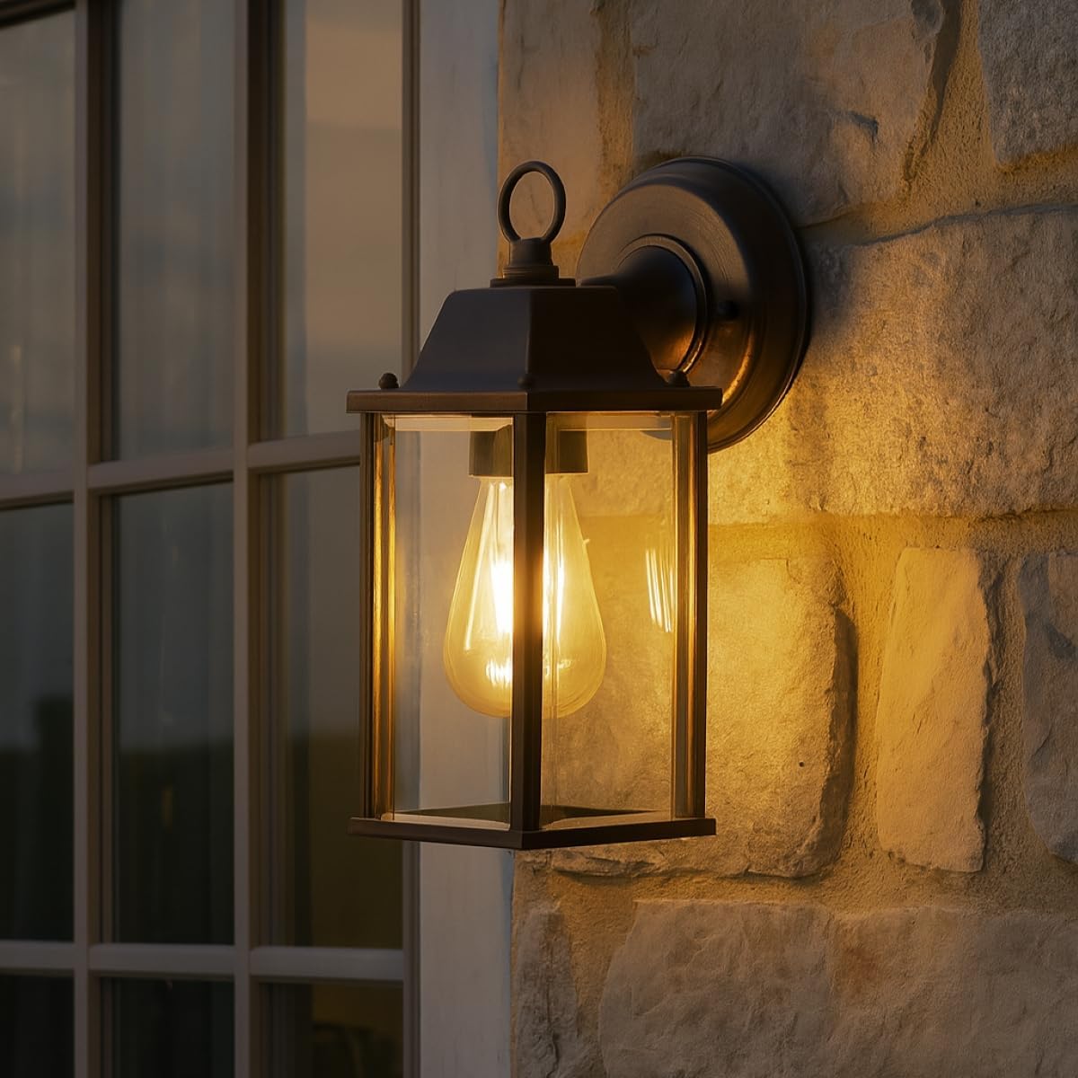 Decorative outdoor wall light fixture on a stone wall