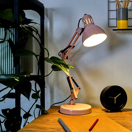 Close-up of the adjustable swing arm mechanism of the desk lamp.​

