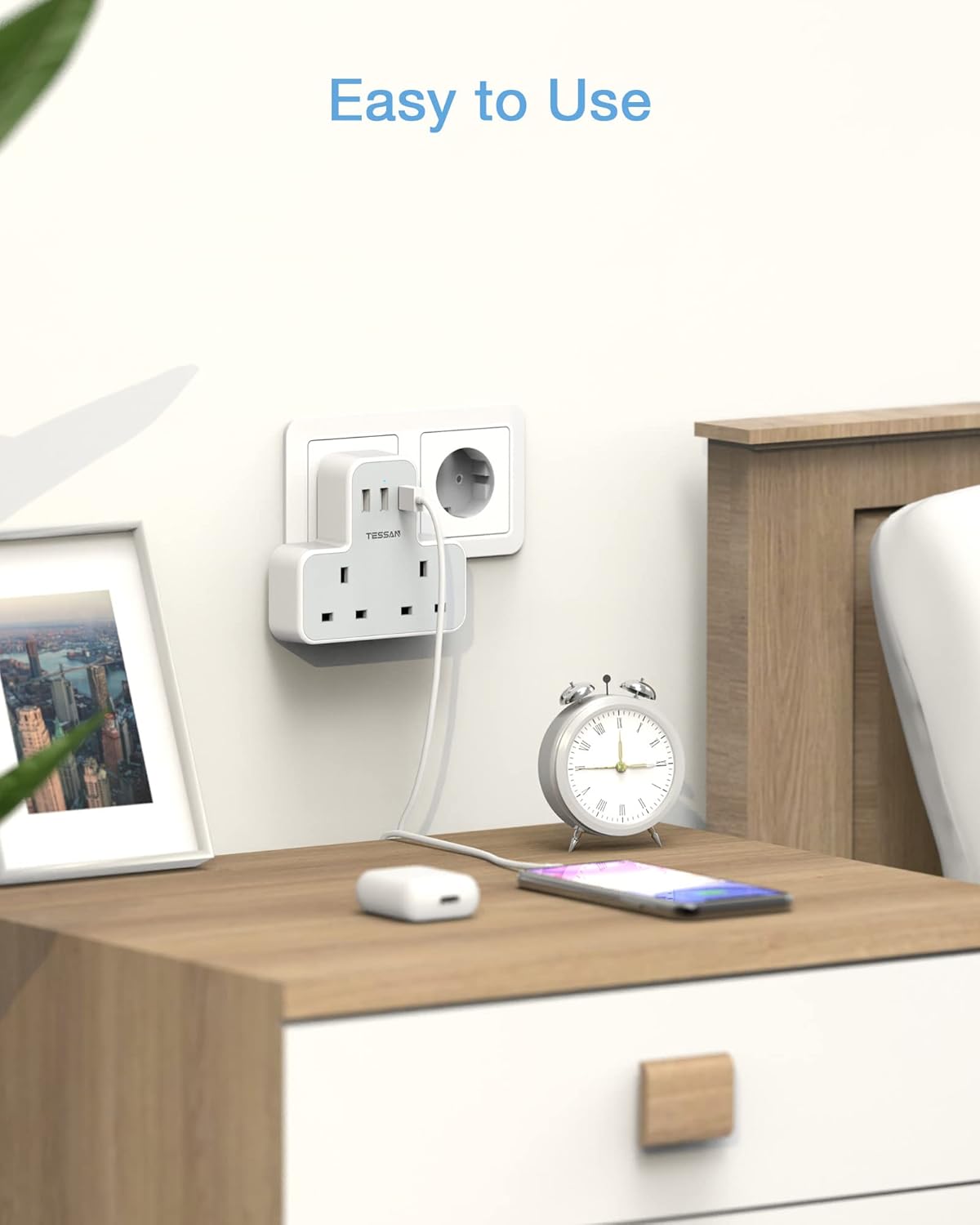 Desk setup with a power strip, clock, and phone, featuring the text 'Easy to Use'.