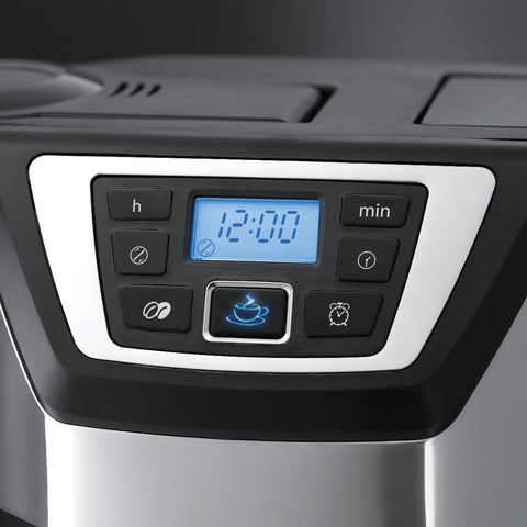Digital clock display on a kitchen appliance with buttons and a screen.