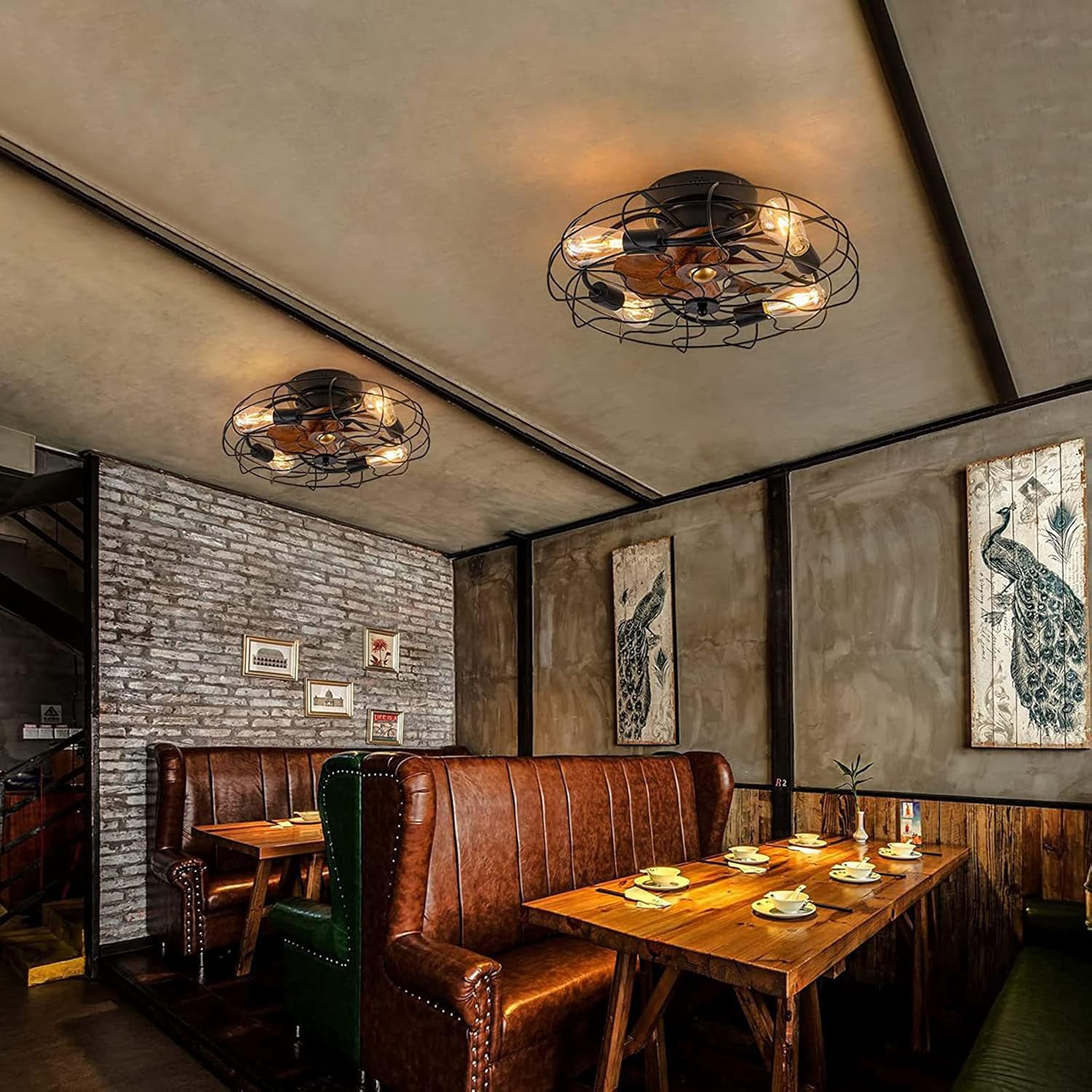 Dining area with leather booths, wooden tables, and decorative wall art in a rustic setting.