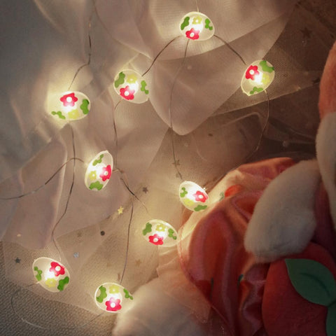 Easter LED lights draped on mantel featuring egg, bunny and chick shapes