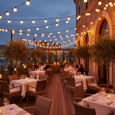 Evening outdoor dining area with string lights and tables set for meals.