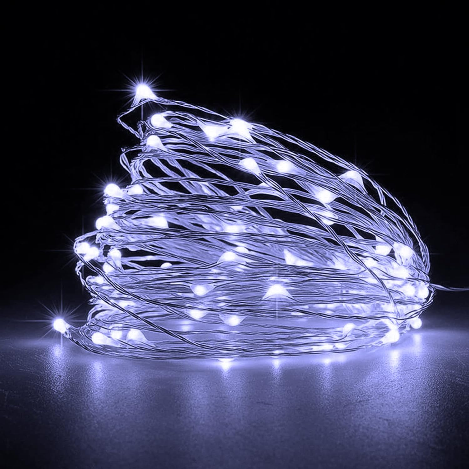 Red string lights wrapped around a Christmas tree

