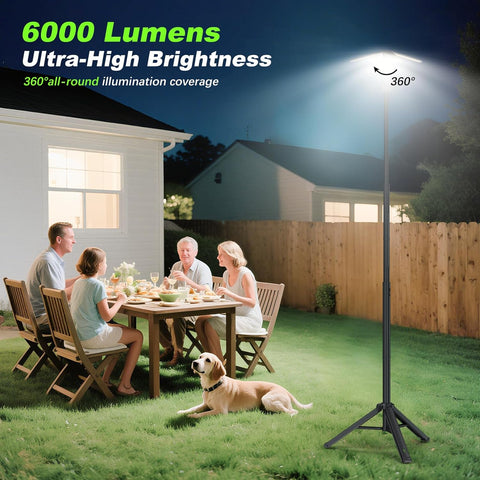 Family enjoying a meal outdoors under a large outdoor light with 6000 lumens and 360-degree illumination.