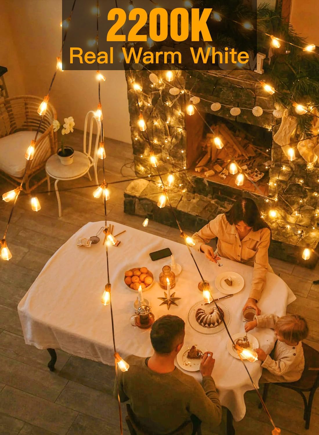 Family gathered around a dining table with warm white string lights in a cozy living room.