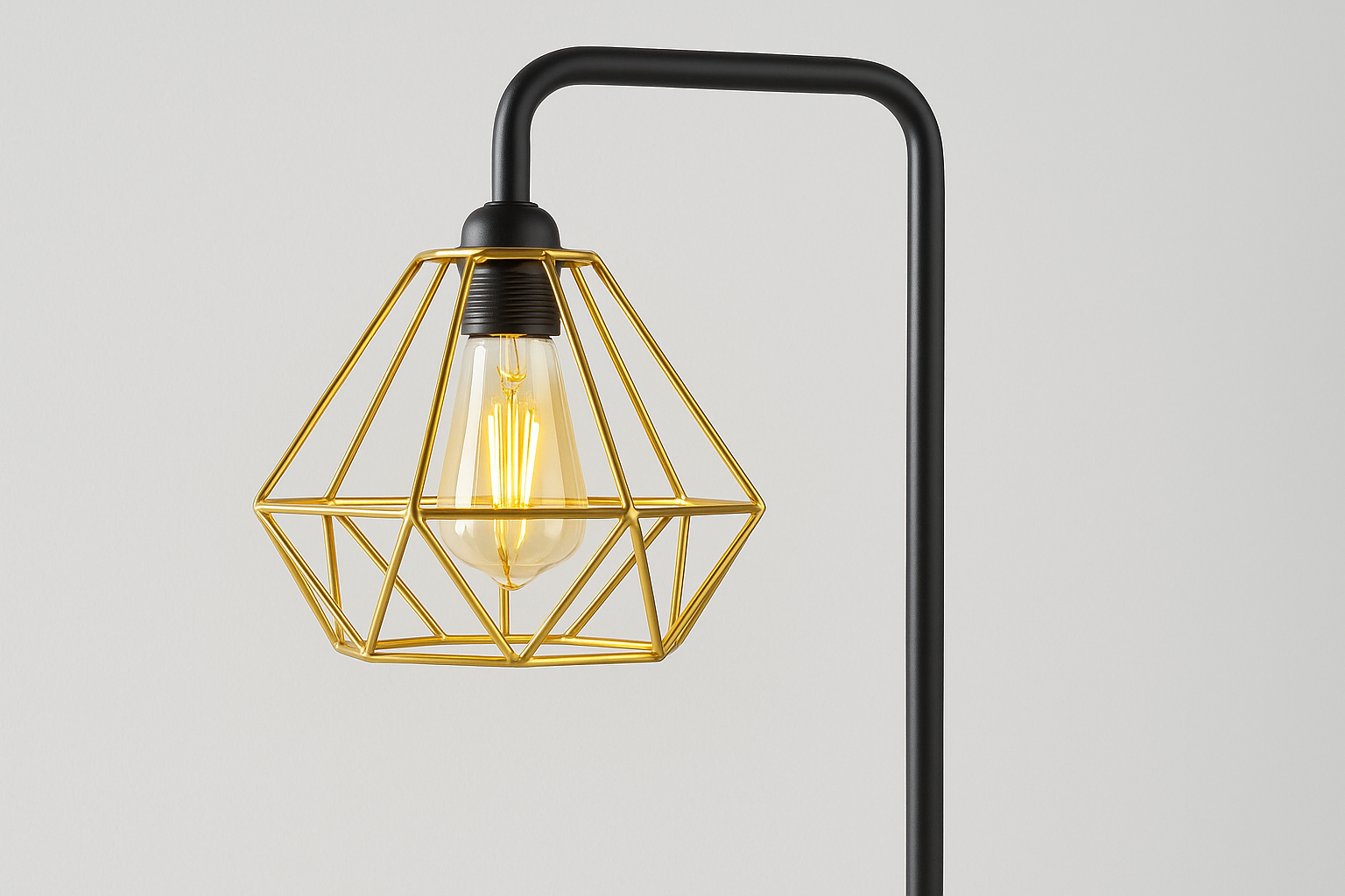 Floor lamp with geometric gold shade and black metal stand on a light gray background