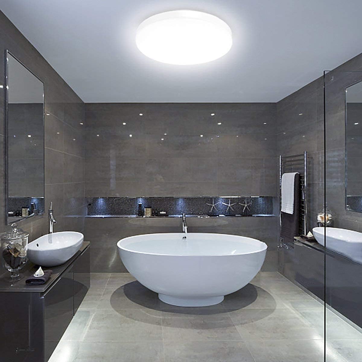 Modern flush mount LED ceiling light installed in a stylish UK bathroom


