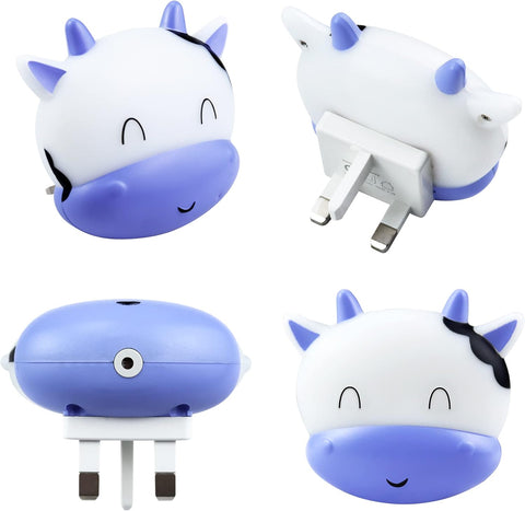 Four cartoon cow-shaped wall sockets on a white background