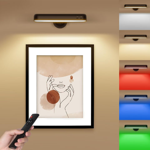 Framed artwork on a wall with a remote control in hand, showing color-changing LED lights.