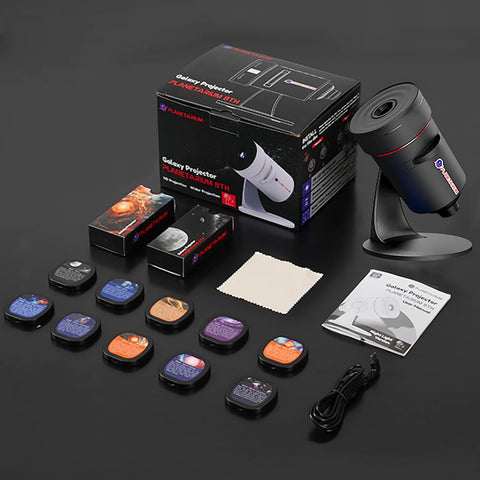 Galaxy projector with accessories on a dark background