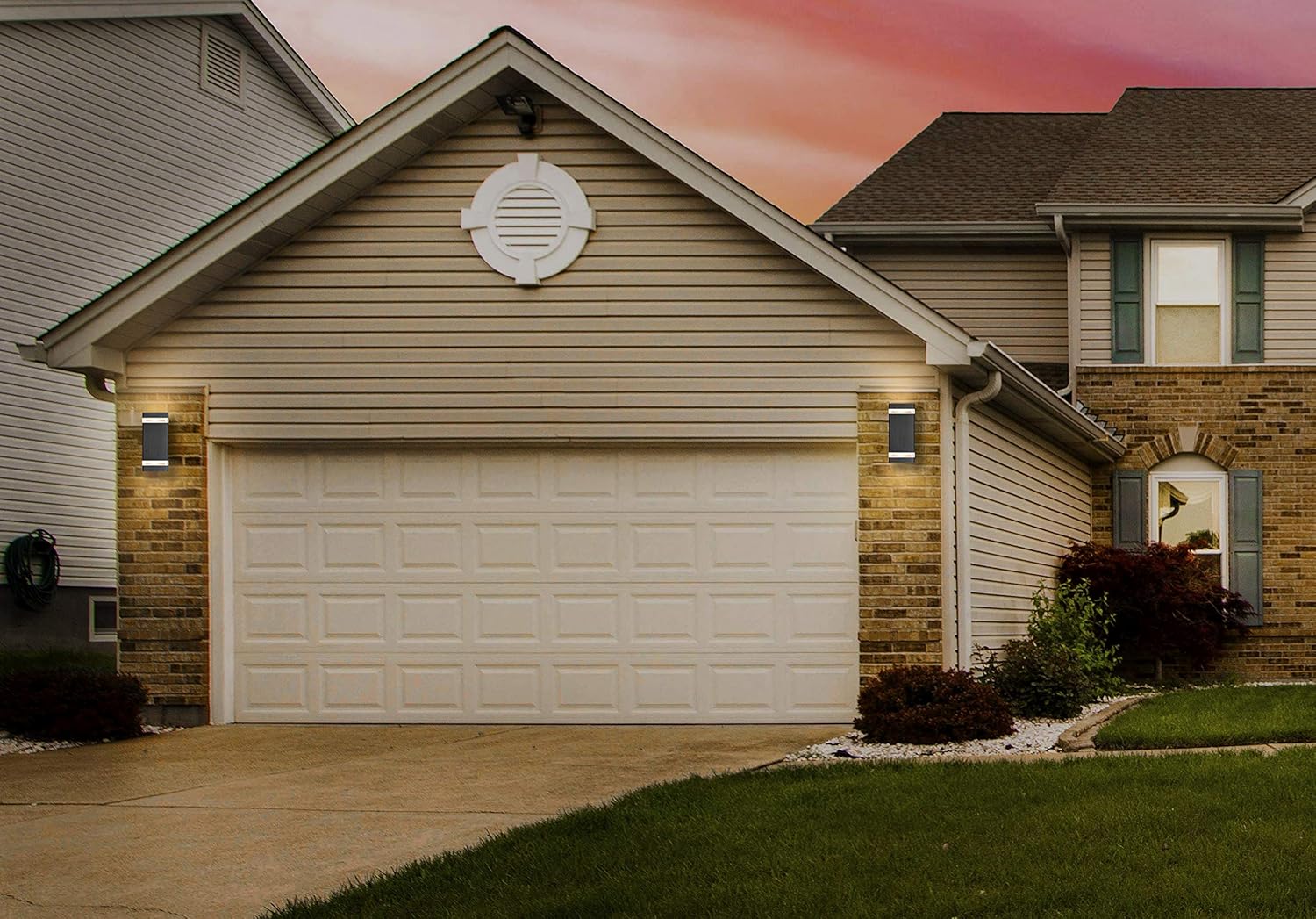 Garage door of a residential house with a sunset sky